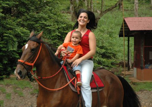 Monica horseback riding with Mariano