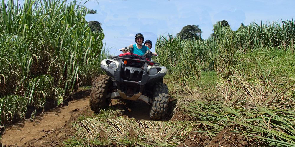 Mom and daughter riding thru sugar cane 