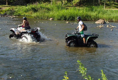 ATV crossing the river near LaFinca, Costa Rica